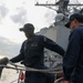 Sailors aboard the John Finn conduct a sea and anchor detail in Changi, Singapore