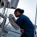 Kearsarge Sailor Hoists Flag