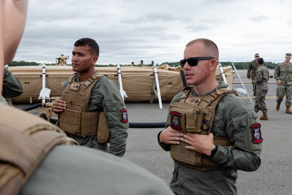 U.S. Marines with MWSS-273 refuel CH-53E Super Stallions with HMH-464