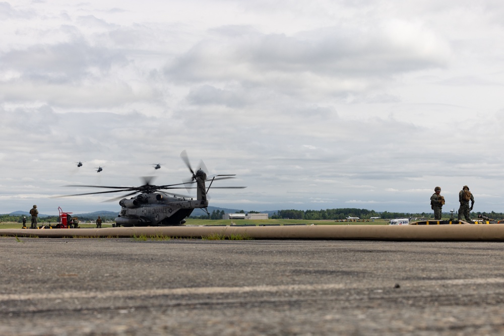 U.S. Marines with MWSS-273 refuel CH-53E Super Stallions with HMH-464