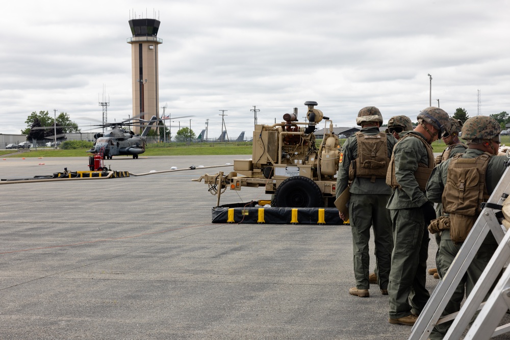 U.S. Marines with MWSS-273 refuel CH-53E Super Stallions with HMH-464