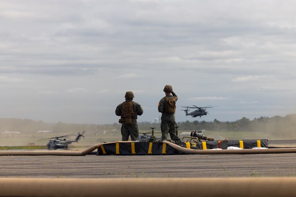U.S. Marines with MWSS-273 refuel CH-53E Super Stallions with HMH-464