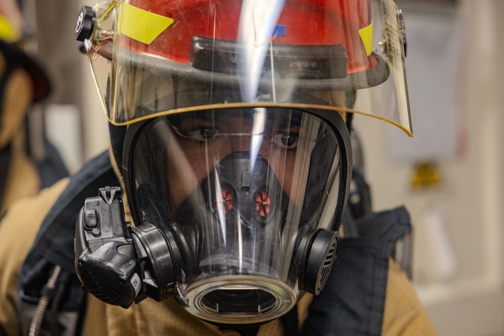 Sailors Respond During a Damage Control Drill aboard USS Ralph Johnson