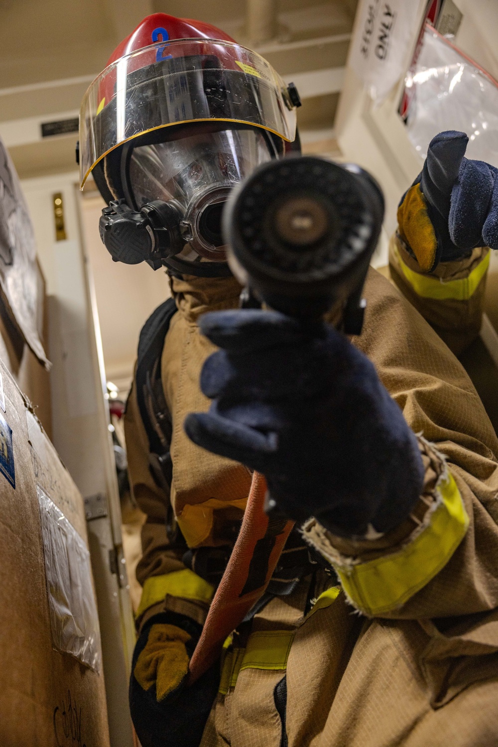 Sailors Respond During a Damage Control Drill aboard USS Ralph Johnson