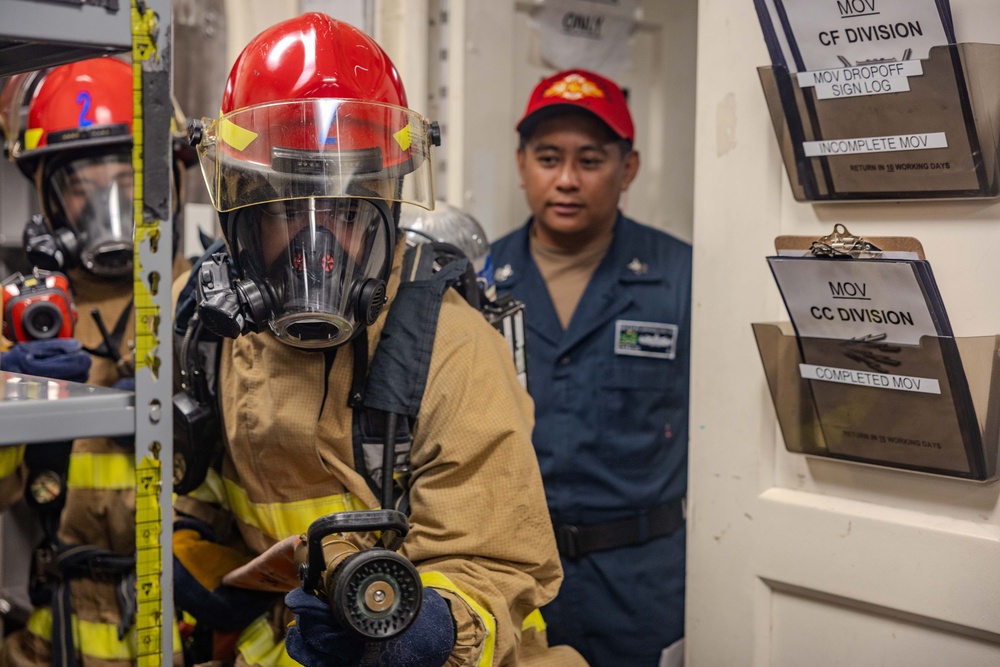 Sailors Respond During a Damage Control Drill aboard USS Ralph Johnson