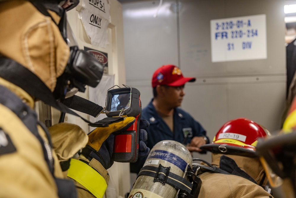 Sailors Respond During a Damage Control Drill aboard USS Ralph Johnson