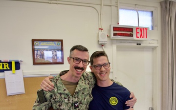 Musician 3rd Class Erik Muench Presented with Farewell Gift