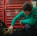 Strike Fighter Squadron 31 Sailor Conducts Maintenance