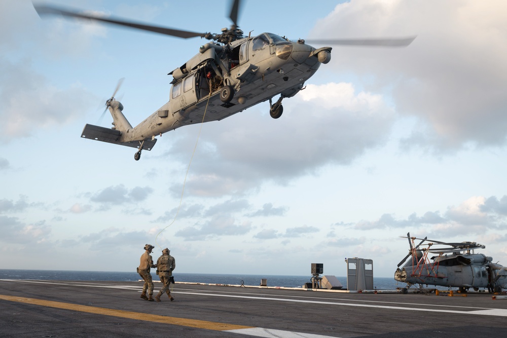 Carrier Strike Group 12 Explosive Ordnance Disposal Technicians Conduct Fast-Rope Exercise