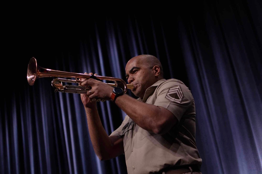 SFC Williams Plays the Trumpet on stage