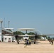 Sailors and contractors prep aircraft for launch
