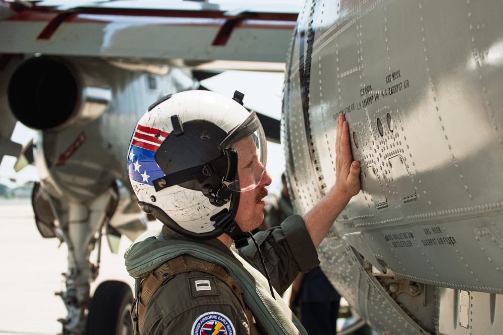 Sailors and contractors prep aircraft for launch