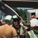 Sailors and contractors prep aircraft for launch