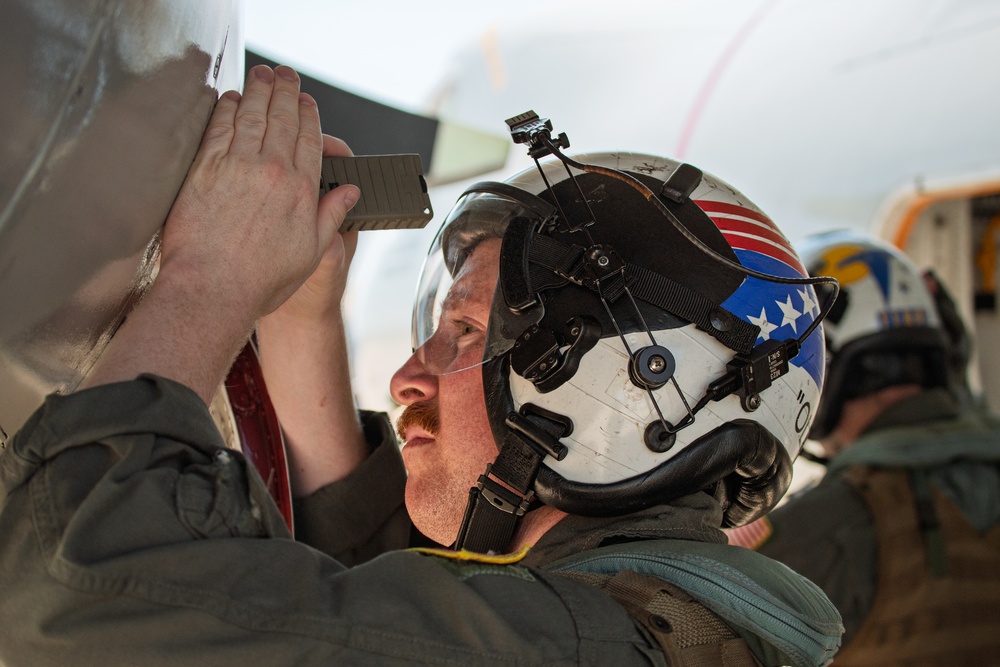 Sailors and contractors prep aircraft for launch