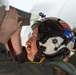 Sailors and contractors prep aircraft for launch