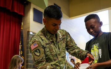 Fort Lee Funeral Honors Team Demonstrate Flag Folding to Youth