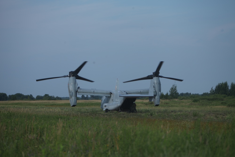 U.S. Marines disembark and offload equipment from an MV-22 Osprey ‘jump’ combat operations center event during Atlantic Alliance 25 (AA25)