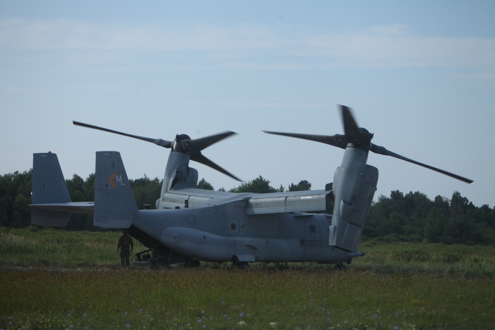 U.S. Marines disembark and offload equipment from an MV-22 Osprey ‘jump’ combat operations center event during Atlantic Alliance 25 (AA25)
