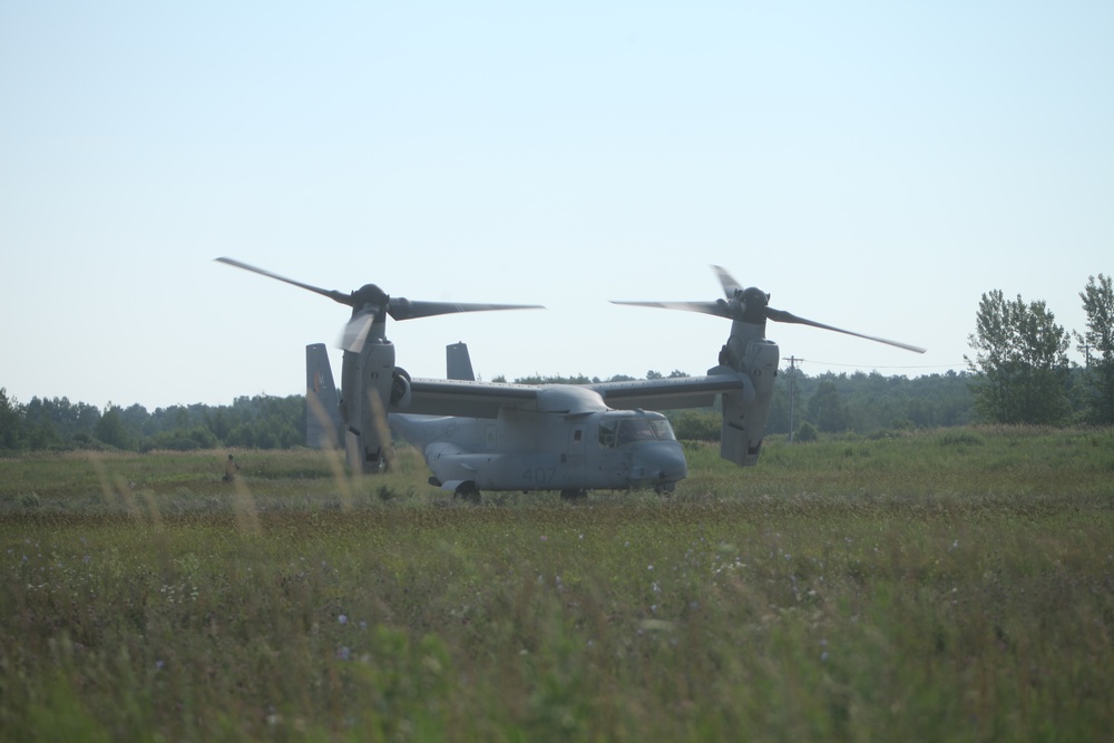 U.S. Marines disembark and offload equipment from an MV-22 Osprey ‘jump’ combat operations center event during Atlantic Alliance 25 (AA25)