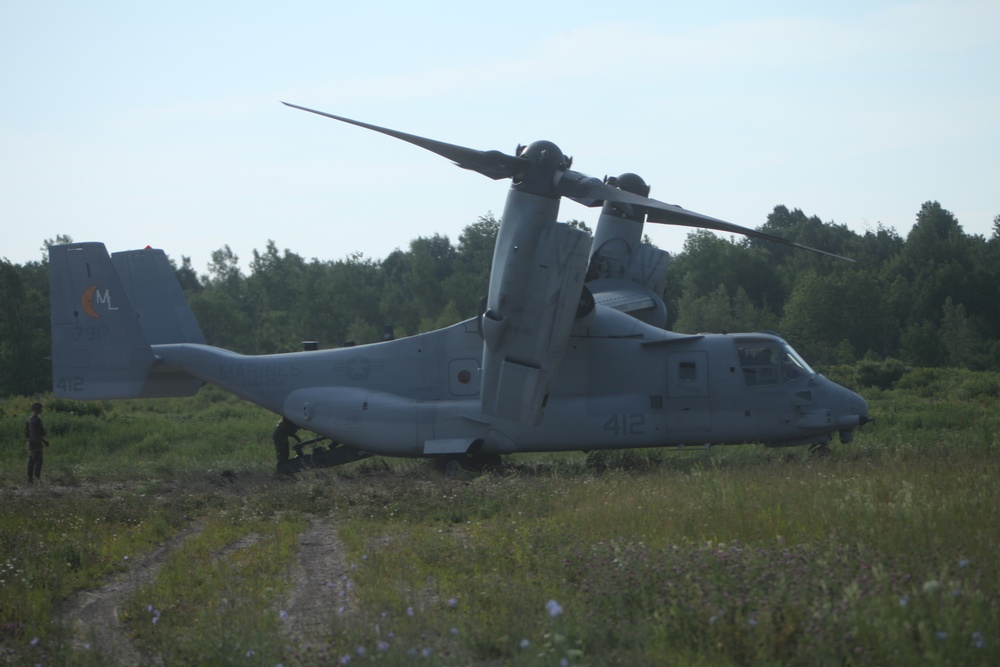 U.S. Marines disembark and offload equipment from an MV-22 Osprey ‘jump’ combat operations center event during Atlantic Alliance 25 (AA25)