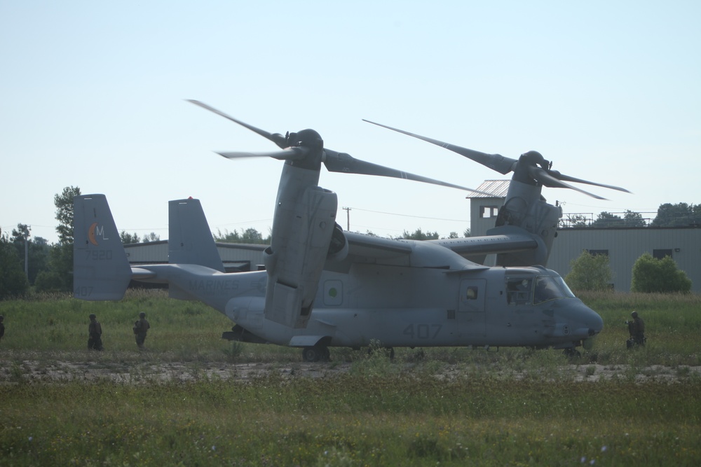 U.S. Marines disembark and offload equipment from an MV-22 Osprey ‘jump’ combat operations center event during Atlantic Alliance 25 (AA25)