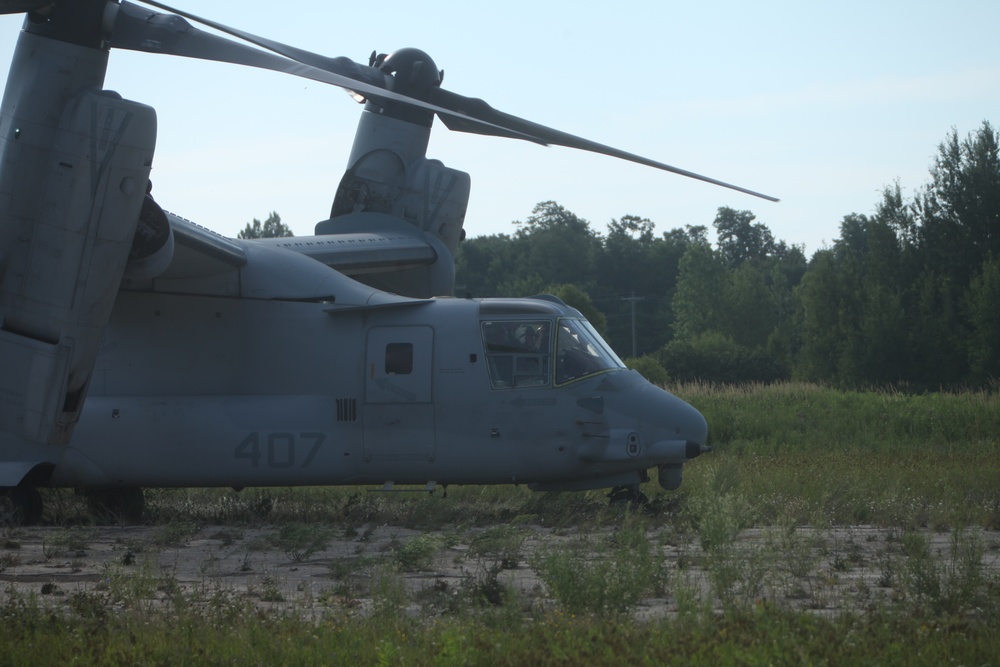 U.S. Marines disembark and offload equipment from an MV-22 Osprey ‘jump’ combat operations center event during Atlantic Alliance 25 (AA25)