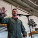 Abraham Lincoln conducts an all-hands call in the hangar bay