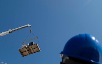 Sailors load medical supplies onto USNS Comfort