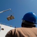 Sailors load medical supplies onto USNS Comfort