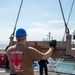 Sailors load medical supplies onto USNS Comfort
