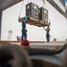 Sailors load medical supplies onto USNS Comfort