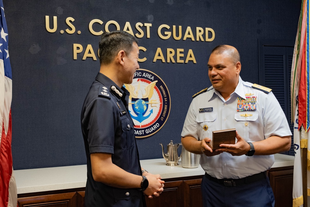U.S. Coast Guard Pacific Area commander presents gift to Singapore Police Coast Guard leadership