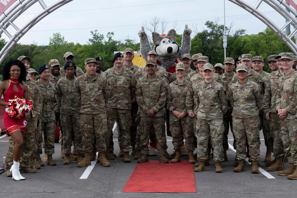 Team Whiteman members visit with the Chiefs