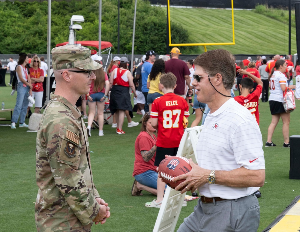 Team Whiteman members visit with the Chiefs