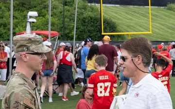 Team Whiteman members visit with the Chiefs