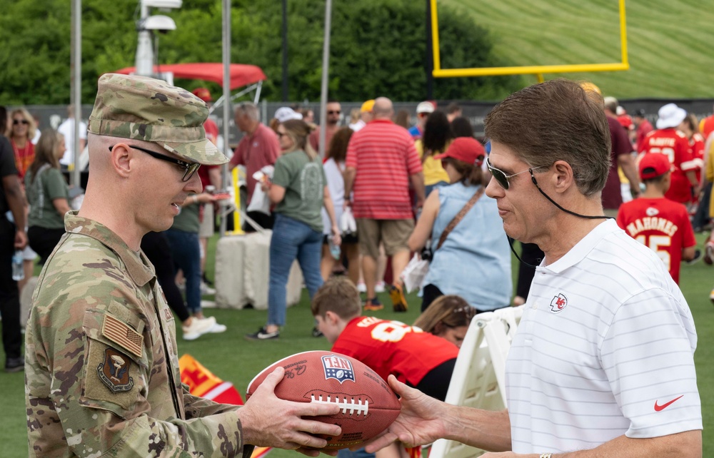 Team Whiteman members visit with the Chiefs