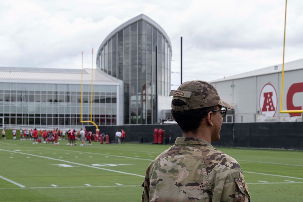 Team Whiteman members visit with the Chiefs