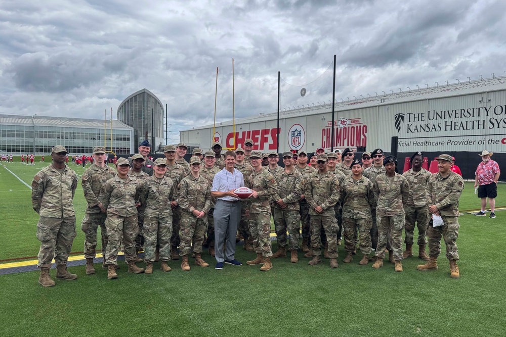 Team Whiteman members visit with the Chiefs