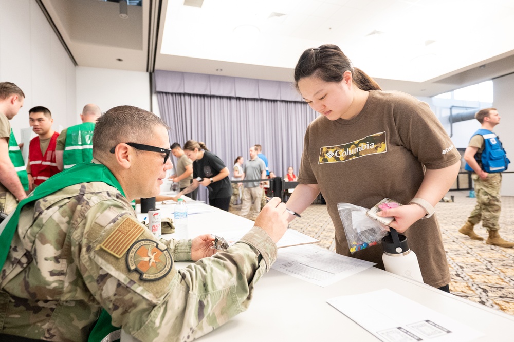 Medical staff practices biohazard disaster response during readiness exercise