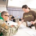 Medical staff practices biohazard disaster response during readiness exercise