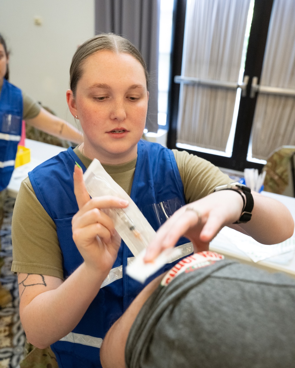 Medical staff practices biohazard disaster response during readiness exercise