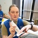 Medical staff practices biohazard disaster response during readiness exercise