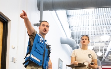 Medical staff practices biohazard disaster response during readiness exercise