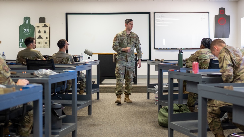 Holloman Combat Arms Training and Maintenance cadre make students and equipment ready for battle