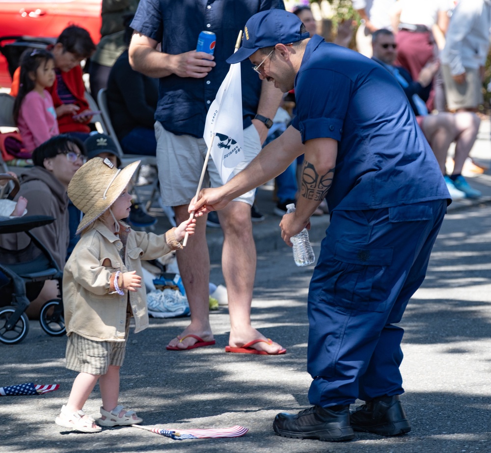 U.S. Coast Guard members march in annual Fourth of July parade