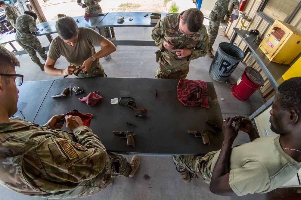 Holloman Combat Arms Training and Maintenance cadre make students and equipment ready for battle