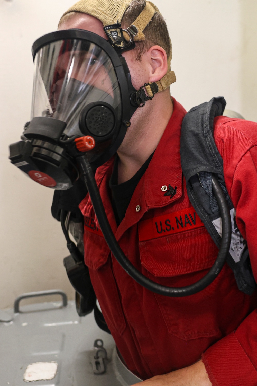 DC3 Levi Nuslein climbs through a water tight scuttle