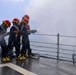 USS Bulkeley Sailors operate the firehose during a damage control evolution.