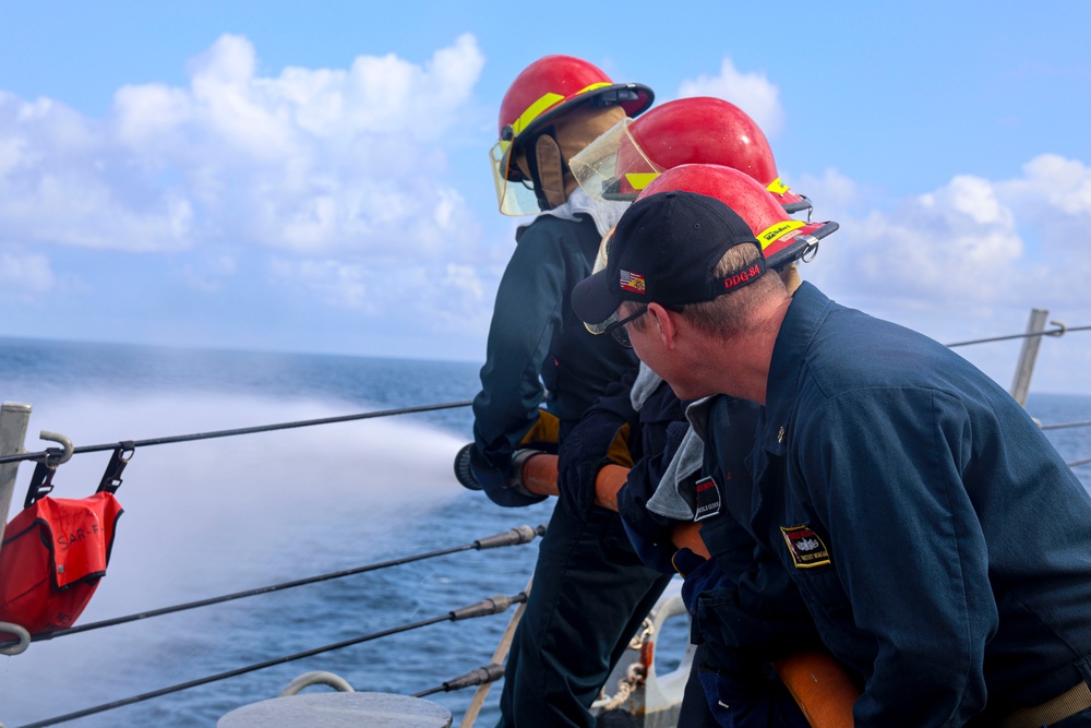 DCC Timothy Morgan instructs a fire team on the fo’c’sle