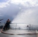 PSC William Brockman  instructs a fire team on the fo’c’sle during a damage control evolution